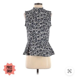 Sleeveless peplum top with floral print in navy blue and white